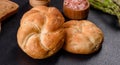 Crusty round bread rolls, known as Kaiser or Vienna rolls on a cutting board Royalty Free Stock Photo