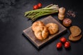 Crusty round bread rolls, known as Kaiser or Vienna rolls on a cutting board Royalty Free Stock Photo