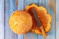 Crusty round bread made in home on wooden background