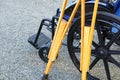 The crutches lean against the wheelchair