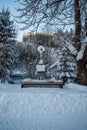 Cruxifix in winter landscape with snow, trees and clear sky Royalty Free Stock Photo