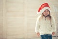 Happy little smiling girl with christmas gift box. Royalty Free Stock Photo