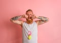 Cry man with beard and tattoos acts like a small newborn Royalty Free Stock Photo
