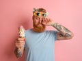 Cry man with beard and tattoos does not like the icecream Royalty Free Stock Photo