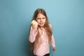 The cry. Teen girl on a blue background. Facial expressions and people emotions concept Royalty Free Stock Photo