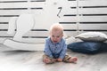 Crybaby boy sittin on the floor. Baby crying and screaming. Royalty Free Stock Photo