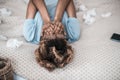 Crying african american woman lying on bed