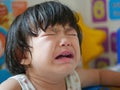 A crying little Asian baby girl with tears Royalty Free Stock Photo