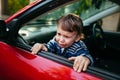 Crying baby boy in car. The boy is crying and wants to get out of the maniche Royalty Free Stock Photo