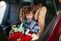 Crying baby boy in a safety car seat Royalty Free Stock Photo