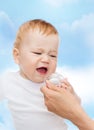 Crying baby with dummy Royalty Free Stock Photo