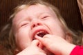 Crying baby girl close up selective focus Royalty Free Stock Photo