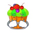 Crying black currant cupcake isolated on mascot Royalty Free Stock Photo