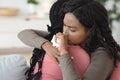 Crying black woman hugging her girlfriend or sister Royalty Free Stock Photo