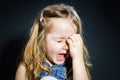 Crying blond little girl with focus on her tears Royalty Free Stock Photo