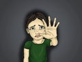 Crying boy, hand signals to stop the violence and pain. Portrait