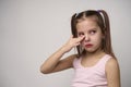 Crying child girl against white background