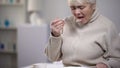 Crying elderly lady eating dinner, suffering from loneliness in old age, closeup Royalty Free Stock Photo