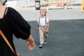 Crying four year old boy walking to his mother for hugs and comfort Royalty Free Stock Photo