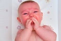 Crying Infant baby boy at the age of four months, close-up portrait Royalty Free Stock Photo