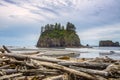 The Crying Lady Rock, iconic sea stack with driftwoods in the foreground at Second Beach, Quillayute Needles, La Push, Olympic