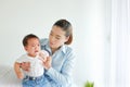 crying little boy being consoled by mother