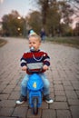 Crying boy on bike. Family, childhood, season and people concept