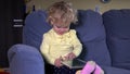 Crying little child girl get tablet computer and calm down immediately