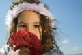 Crying little girl with roses