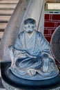 Close up of the crying monk statue in the Khoo Kongsi Temple that interplay sorrow in human existence Royalty Free Stock Photo