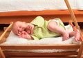 Crying newborn baby boy lying in carriage Royalty Free Stock Photo