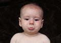 Crying Pouting sad baby looking cute Royalty Free Stock Photo