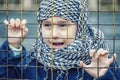 A refugee girl from the east in a headscarf Royalty Free Stock Photo