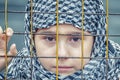 A refugee girl from the east in a headscarf Royalty Free Stock Photo