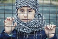 A refugee girl from the east in a headscarf Royalty Free Stock Photo