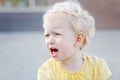 crying screaming little white blond Caucasian toddler boy girl Royalty Free Stock Photo