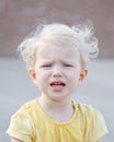 Crying screaming little white blond Caucasian toddler boy girl Royalty Free Stock Photo