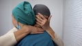 Crying sick female hugging oncologist, no hope, disappointing news, sarcoma Royalty Free Stock Photo