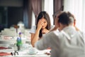 Crying stressed woman in fear,having a conversation with a man about problems.Reaction to negative event,handling bad news Royalty Free Stock Photo