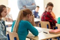 Crying student girl with test result and teacher Royalty Free Stock Photo