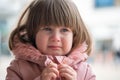 Crying toddler baby girl closeup, soft focus, outside portrait, spring time. Royalty Free Stock Photo