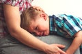 Crying unhappy boy hugging his mother Royalty Free Stock Photo