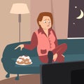 Crying woman watching tv and eating cookies