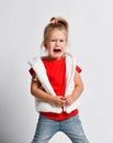 Crying, yelling, abused baby girl in red t-shirt. Got lost. Helpless. Defenceless. Family conflict, violence Royalty Free Stock Photo