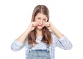 Crying young teenage girl in jeans overalls isolated Royalty Free Stock Photo