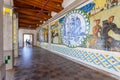 Crypt tiles with Bible and St Benedict life passages.