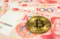 Crypto currency concept - A Bitcoin with Chinece currency RMB, Renminbi, yuan