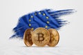 Crypto currency, gold coin BITCOIN BTC. Coin bitcoin against the background of the European Union flag. The concept a new currency