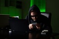 Crypto currency hacking. Hacking hunting for crypto currency. Cryptocurrency hack. Hacker in hoodie dark night theme. Digital data Royalty Free Stock Photo