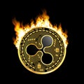 Crypto currency ripple golden symbol on fire